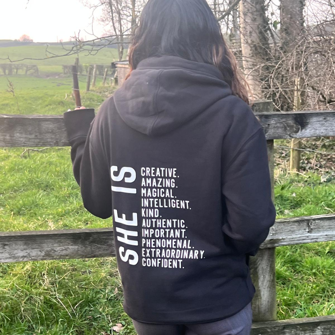 SHE IS - HOODIE